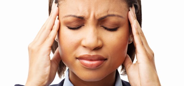 Female Executive Suffering From Headache - Isolated