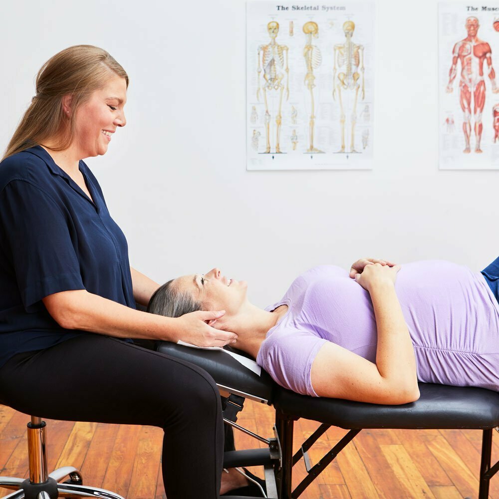 Chiropractor treating a pregnant patient