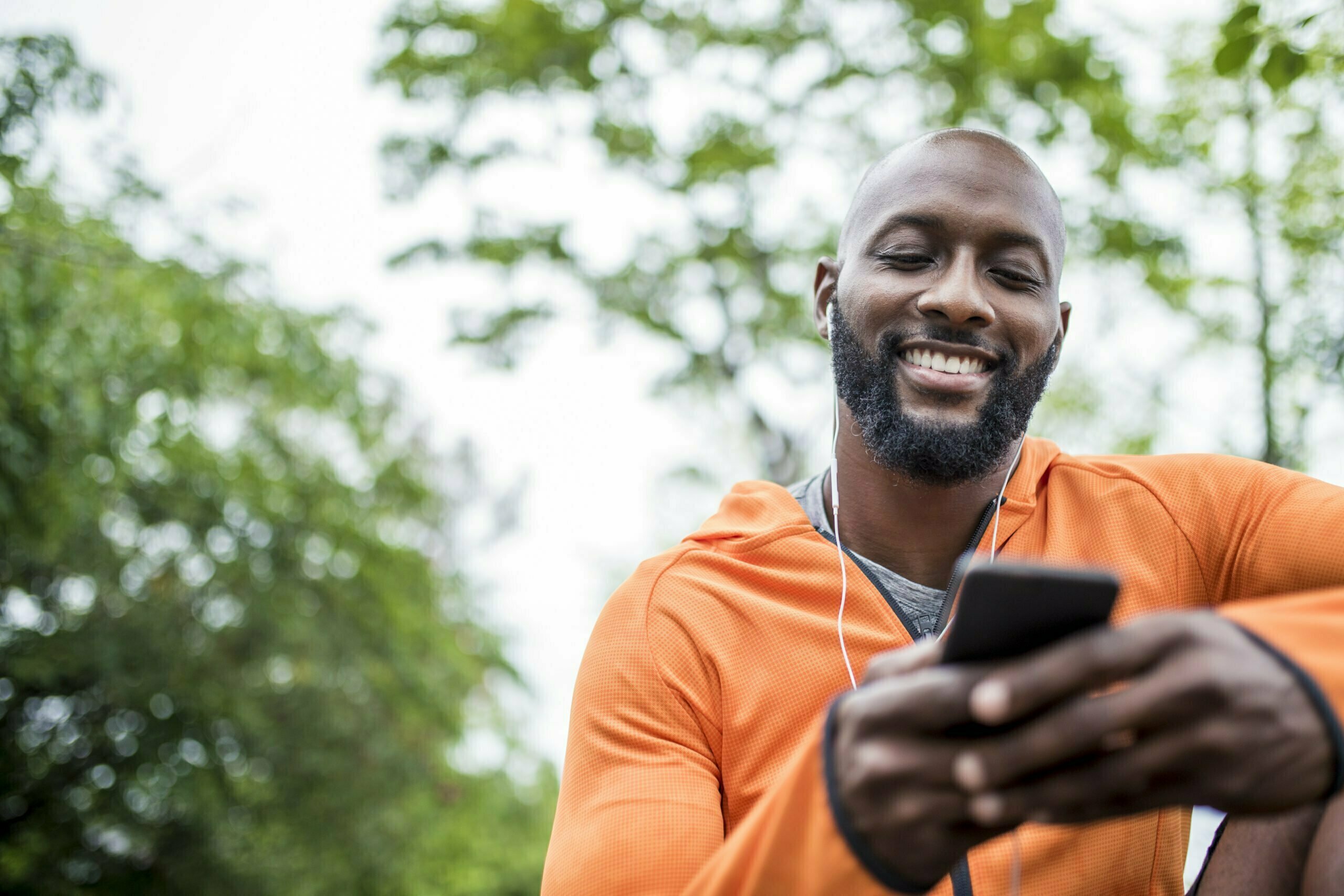 Man holding phone outside