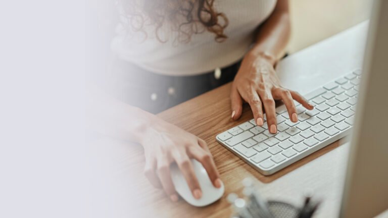 Female typing on computer