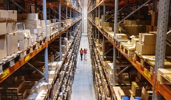 Image of two people in a warehouse