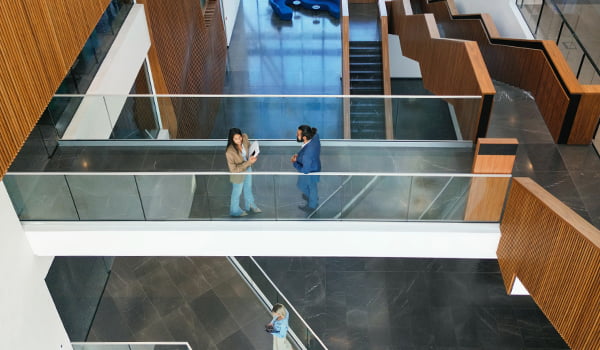 Two people in an office building