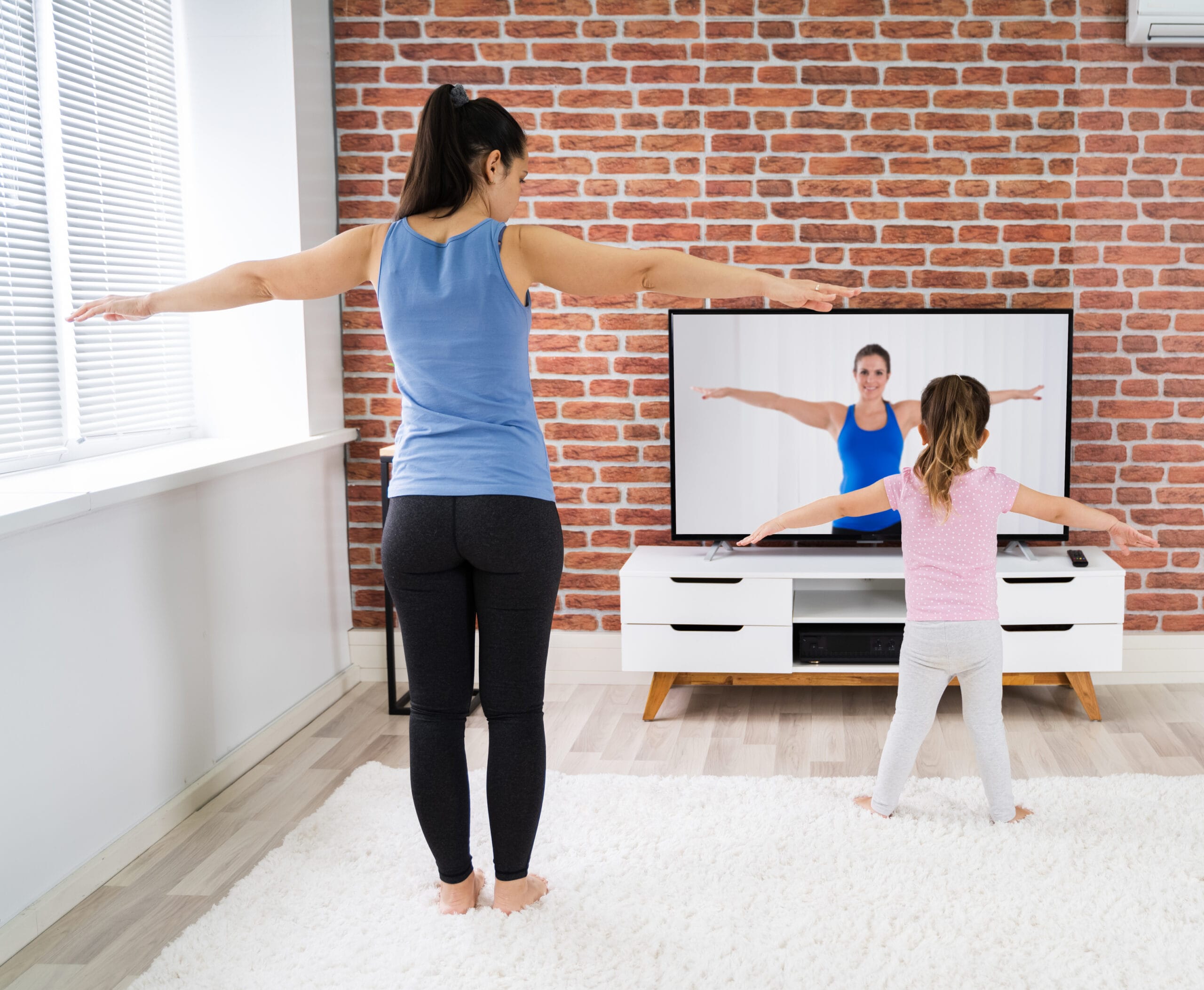 mother and daughter stretching
